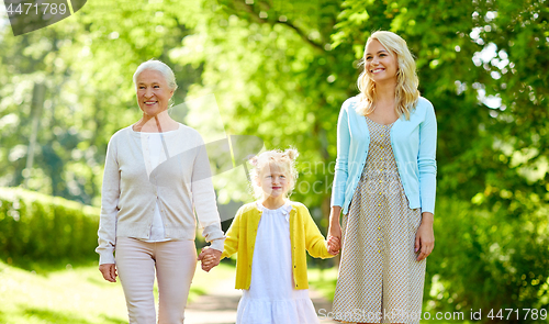 Image of woman with daughter and senior mother at park
