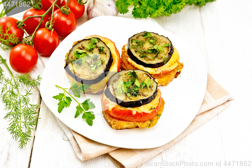 Image of Appetizer of aubergines and cheese in plate on table