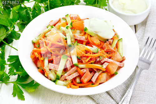 Image of Salad of sausage and spicy carrots on board