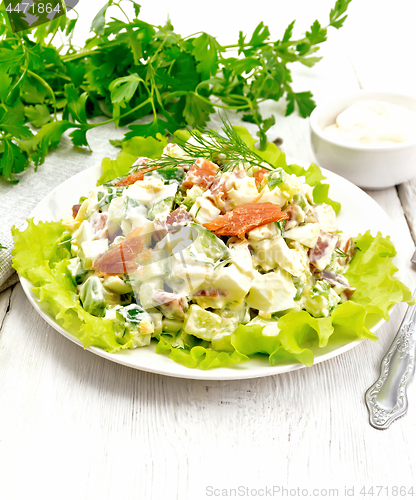 Image of Salad of salmon and avocado with mayonnaise on board