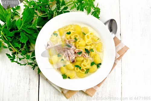 Image of Soup creamy of chicken and pasta in plate on board top