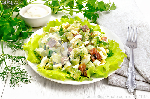 Image of Salad of salmon and avocado on wooden board