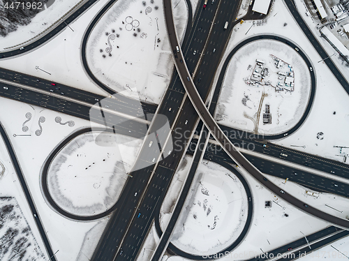 Image of Aerial view of a freeway intersection Snow-covered in winter.