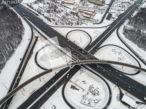 Image of Aerial view of a freeway intersection Snow-covered in winter.