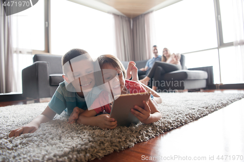 Image of couple spending time with kids