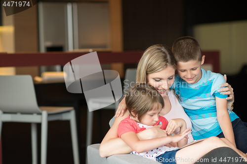 Image of Young Family Using A Tablet To Make Future Plans