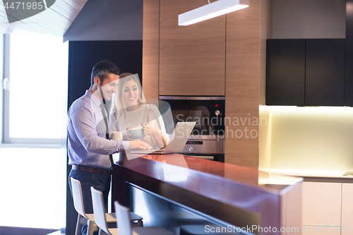 Image of A young couple is preparing for a job and using a laptop