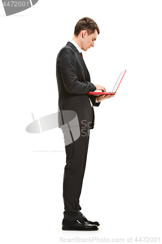 Image of Full body portrait of businessman with laptop on white