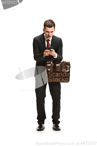 Image of Full body portrait of businessman with briefcase on white