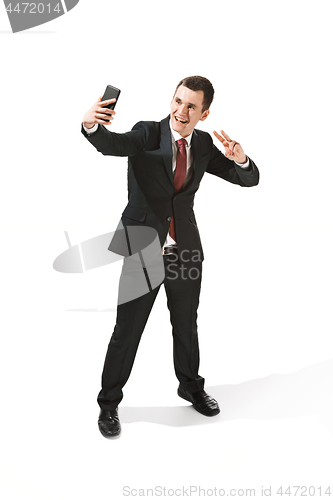 Image of Happy businessman talking on the phone isolated over white background in studio shooting