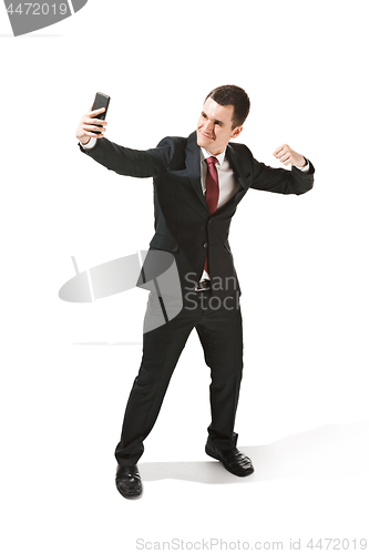 Image of Happy businessman talking on the phone isolated over white background in studio shooting