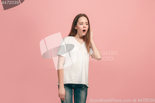 Image of The happy teel girl standing and listening