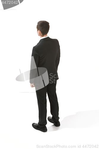 Image of Back view of a businessman. Confident professional in suit