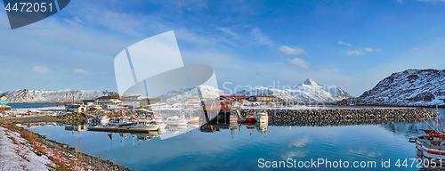 Image of Fishing boats and yachts on pier in Norway