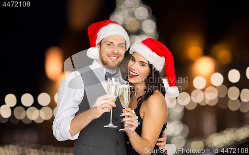 Image of couple with champagne glasses at christmas party