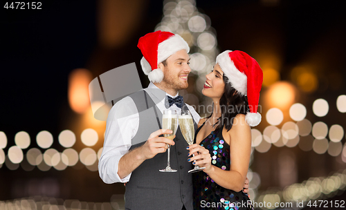 Image of couple with champagne glasses at christmas party