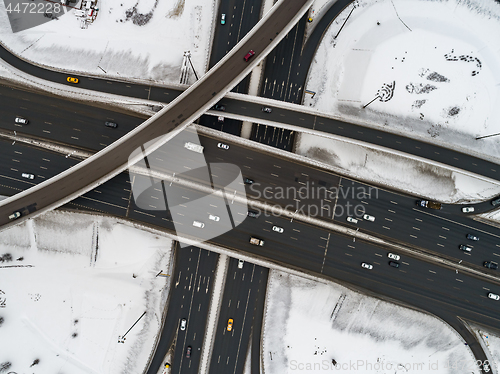 Image of Aerial view of a freeway intersection Snow-covered in winter.