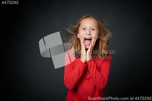 Image of Excited surprised preteen girl screaming of joy