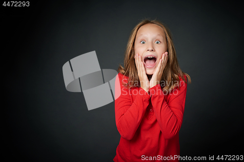 Image of Scared girl shouting looking at camera
