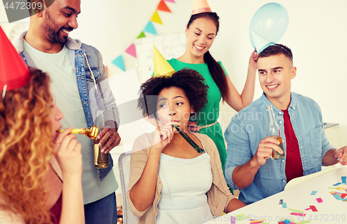 Image of happy team having fun at office party