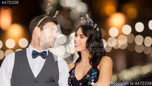 Image of couple with christmas or new year party props