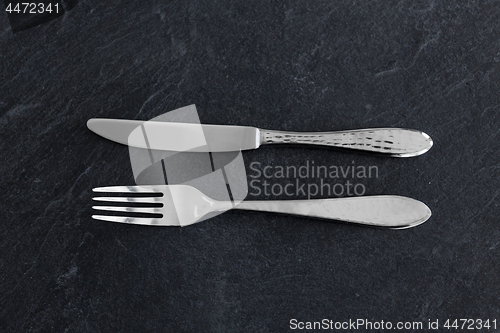 Image of close up of fork and knife on table