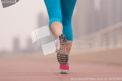 Image of woman running on the promenade