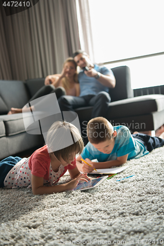Image of young couple spending time with kids