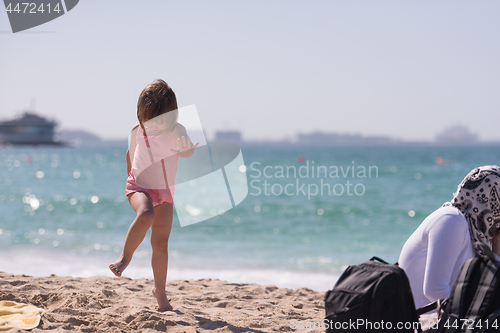 Image of little cute girl at beach