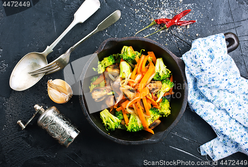 Image of fried mushrooms with vegetables