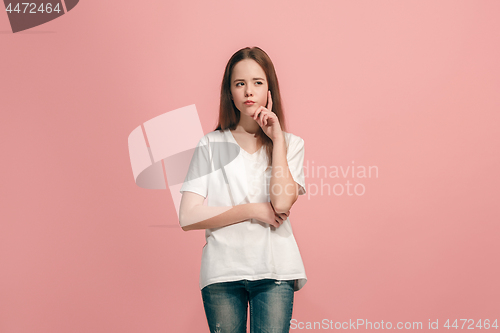 Image of Young serious thoughtful teen girl. Doubt concept.