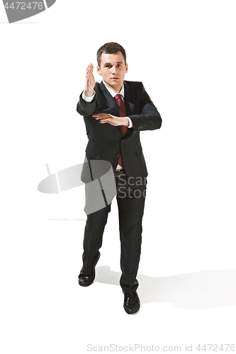 Image of Above portrait of a businessman with very serious face. Confident professional with piercing look in the foreground of the camera.