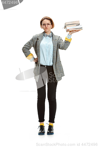 Image of Full length portrait of a happy smiling female student holding books isolated on white background