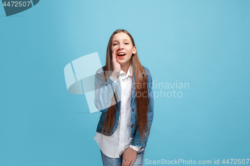 Image of Isolated on pink young casual teen girl shouting at studio