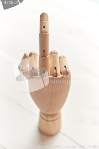 Image of Wooden artificial hand is showing hidden message