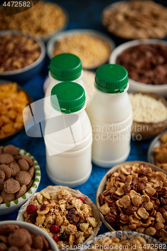 Image of Assortment of different kinds cereals placed in ceramic bowls on table