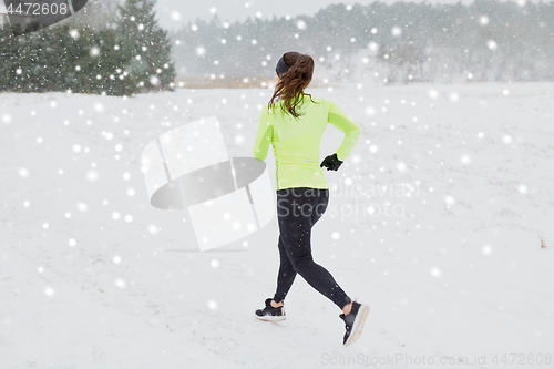 Image of woman running outdoors in winter