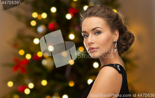 Image of beautiful woman with diamond jewelry on christmas