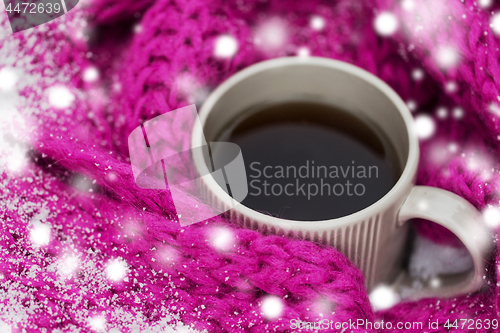 Image of close up of tea or coffee and winter scarf in snow