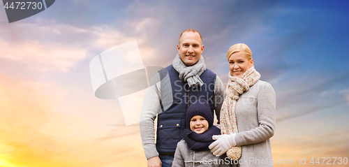 Image of happy family over evening sky background