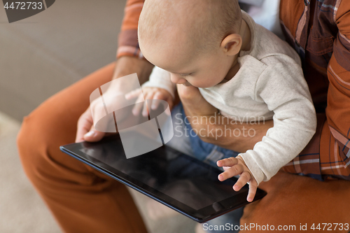 Image of close up of father and baby son with tablet pc