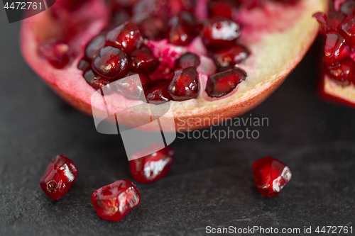 Image of close up of pomegranate on stone table