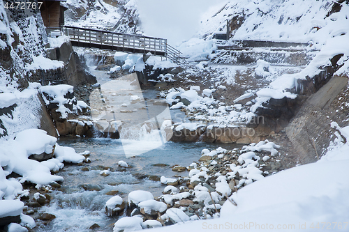 Image of bridge over river in winter, japan