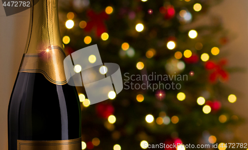 Image of close up of champagne bottle on christmas 