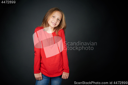 Image of Little girl standing casually