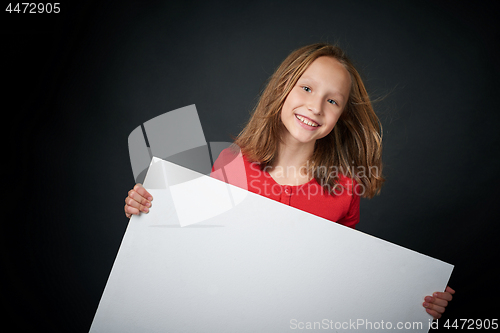 Image of Happy girl looking with widely opened eyes and toothy smile