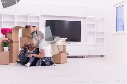 Image of young couple moving  in new house