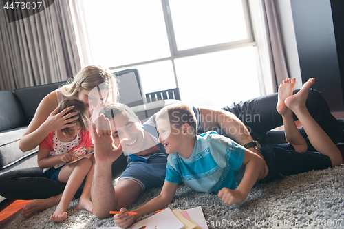 Image of young couple spending time with kids