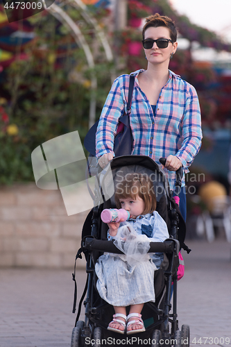 Image of mother and daughter in flower garden