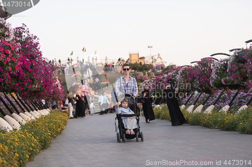 Image of mother and daughter in flower garden